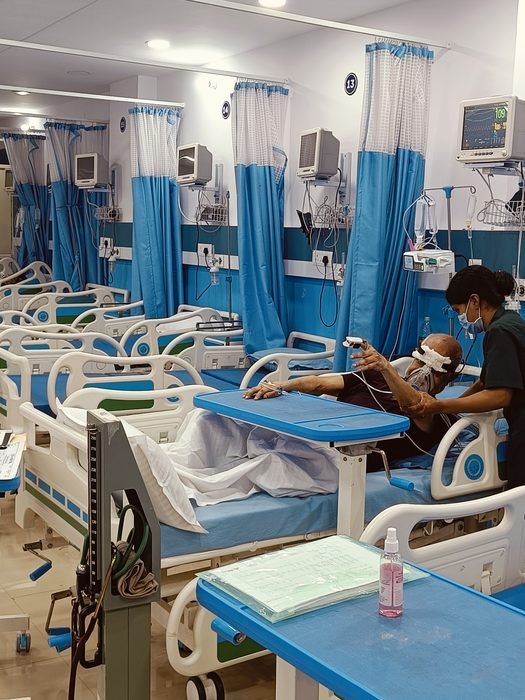 A patient being attended at the bedside